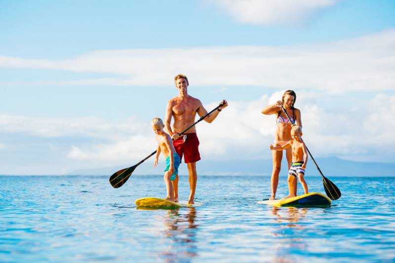 Family paddle boarding in Gold Coast for Easter holiday.