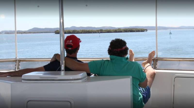 Mates hanging out on luxury houseboat for Easter holiday.