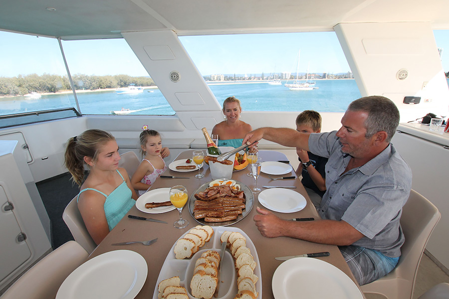 Family dinner on a budget friendly houseboat holiday