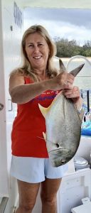 Karen did well landing this solid GT on her Coomera Houseboat Holiday