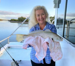 Lisa with her nice catch of Jew Fish on her Coomera Houseboat holiday aboard 'Seaview'