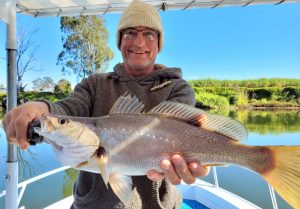 Paul with his first ever Jewfish he caught and released on the Tweed River with Brad Smith Fishing Charters